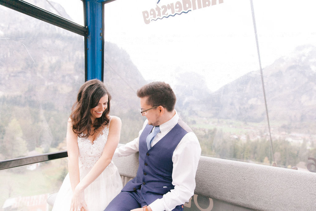 Wedding couple travelling in cable car