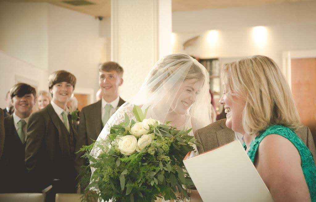 A wedding celebrant leading a ceremony