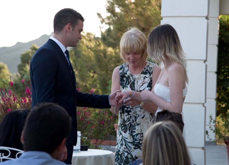 Wedding Celebrant conducts wedding ceremony in Greece