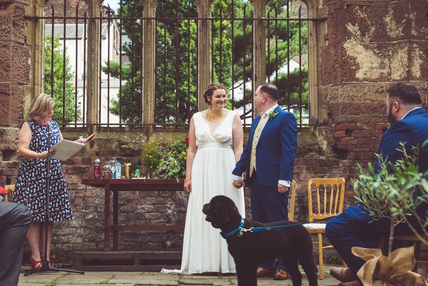 Wedding celebrant leading a wedding ceremony in the Bombed Out Church in Liverpool