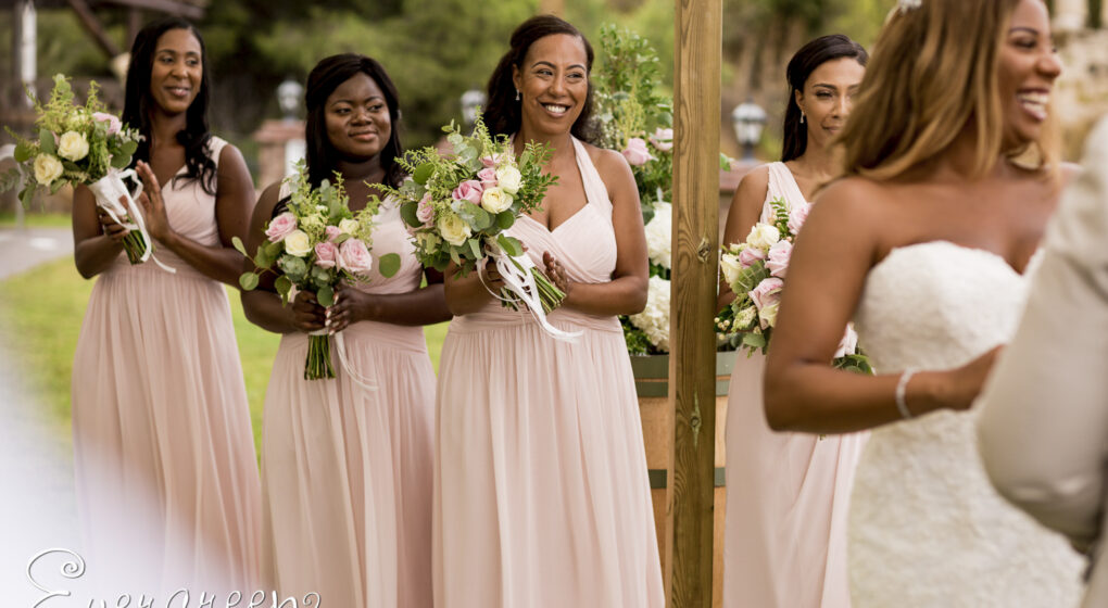 Wedding ceremony in Spanish garden Bridesmaids smiling